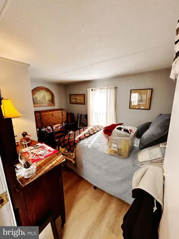 a bedroom with a bed and dresser