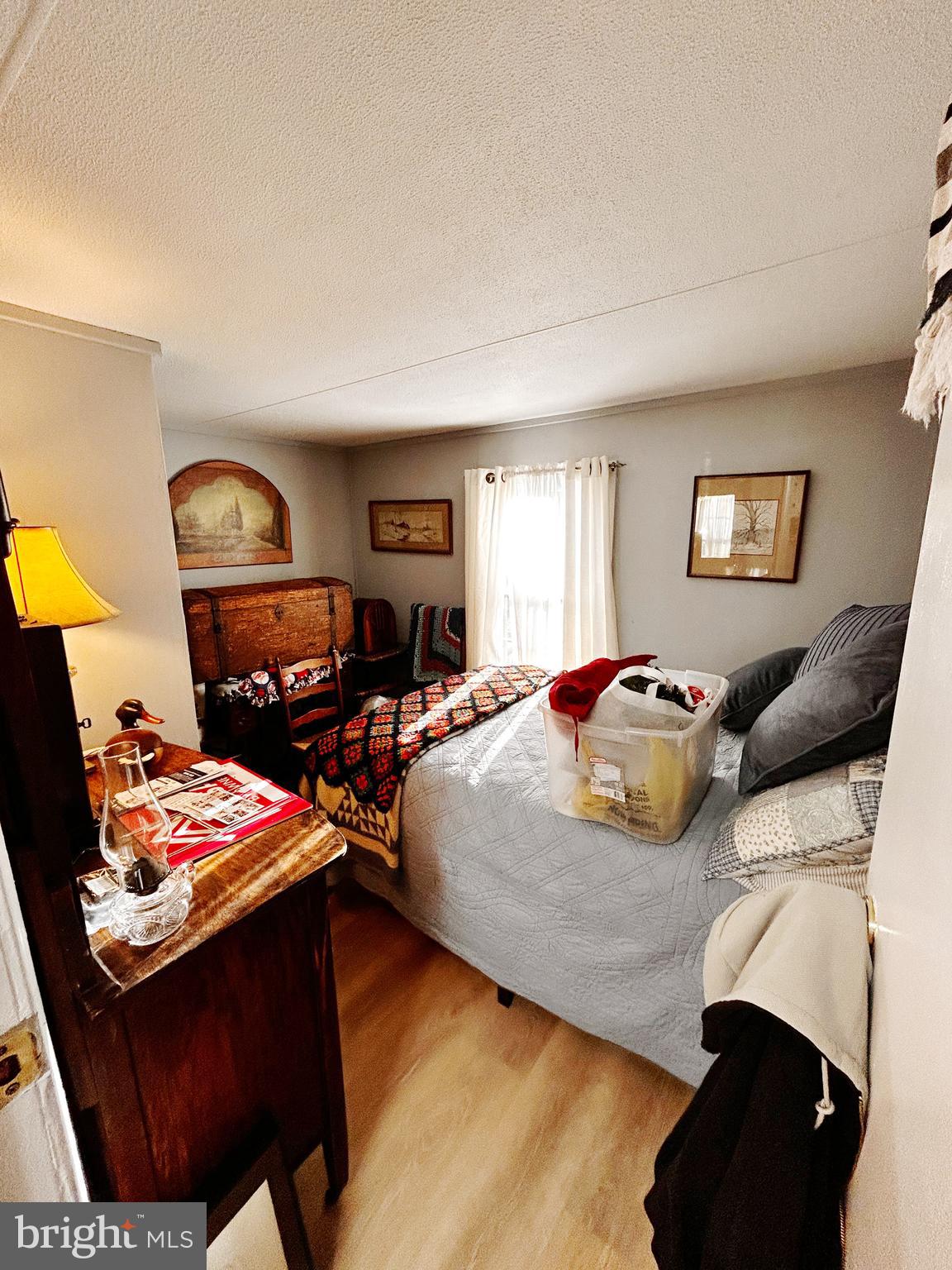 260 Marshall Mill Road, Unit 146 Malaga, NJ 08328 - Photo 18 of 22 a bedroom with a bed and dresser