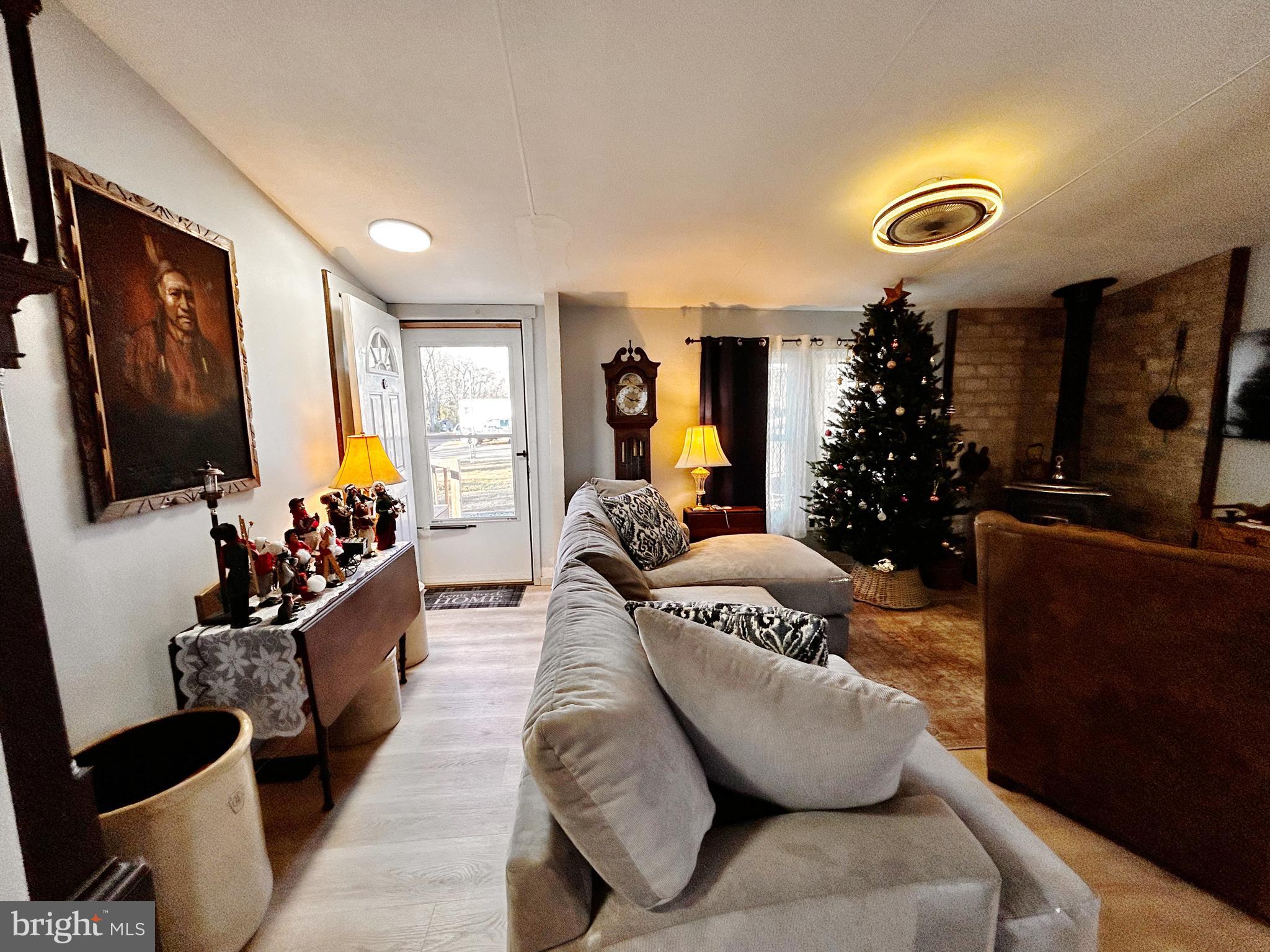 260 Marshall Mill Road, Unit 146 Malaga, NJ 08328 - Photo 4 of 22 a living room with furniture and a flat screen tv