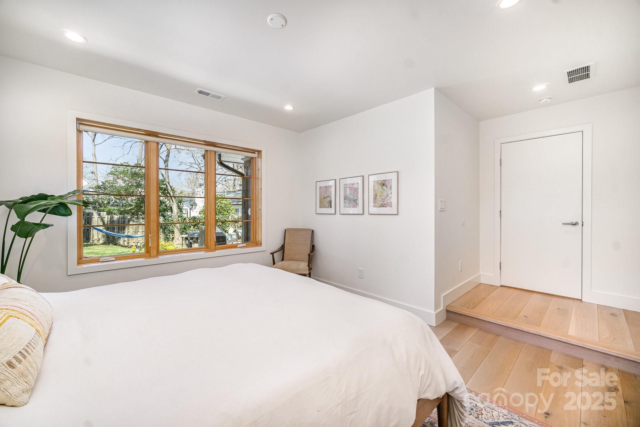 4833 Addison Drive Charlotte, NC 28211 - Photo 11 of 47 a bedroom with a large bed and a window