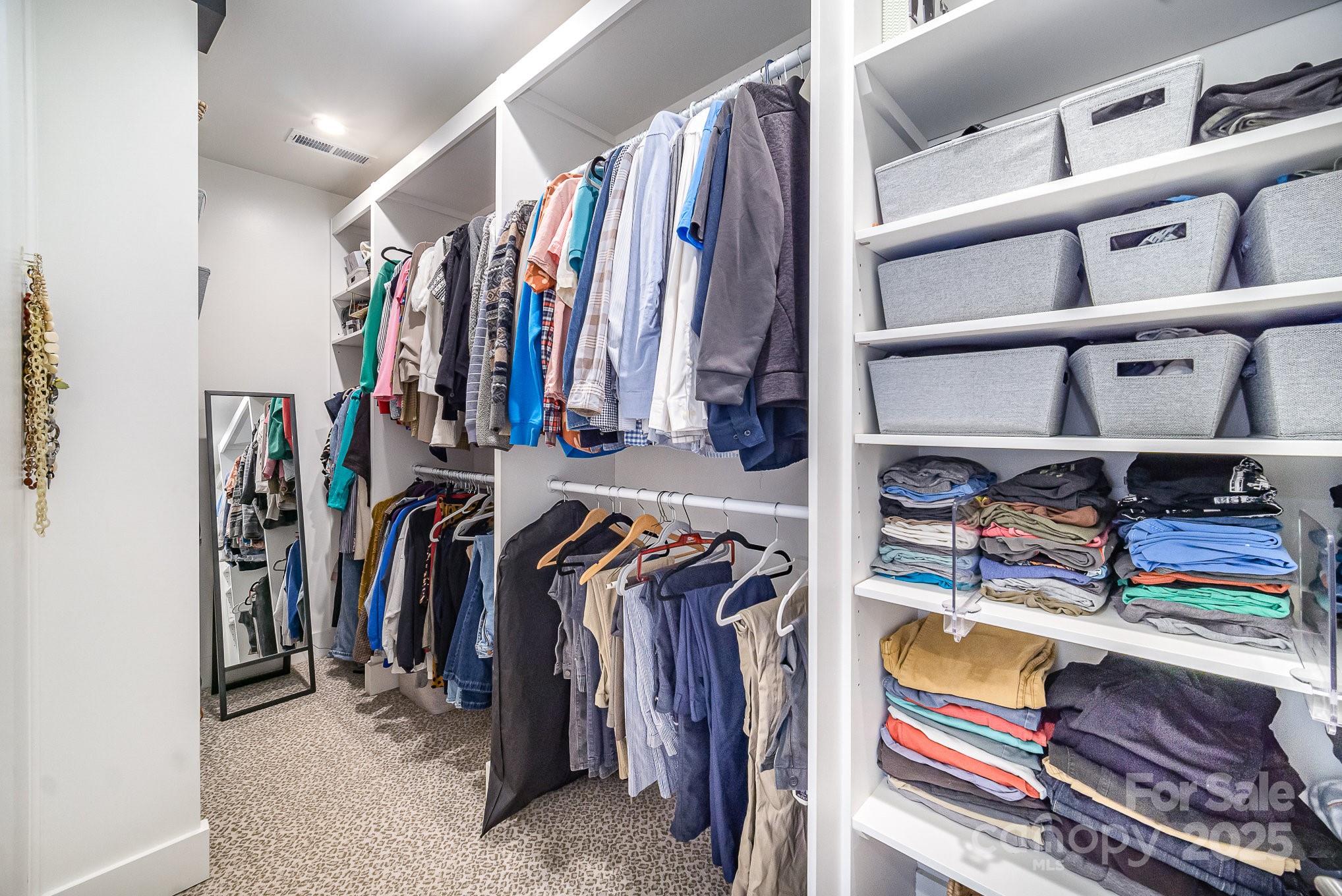 4833 Addison Drive Charlotte, NC 28211 - Photo 15 of 47 a view of walk in closet with clothes and shoes