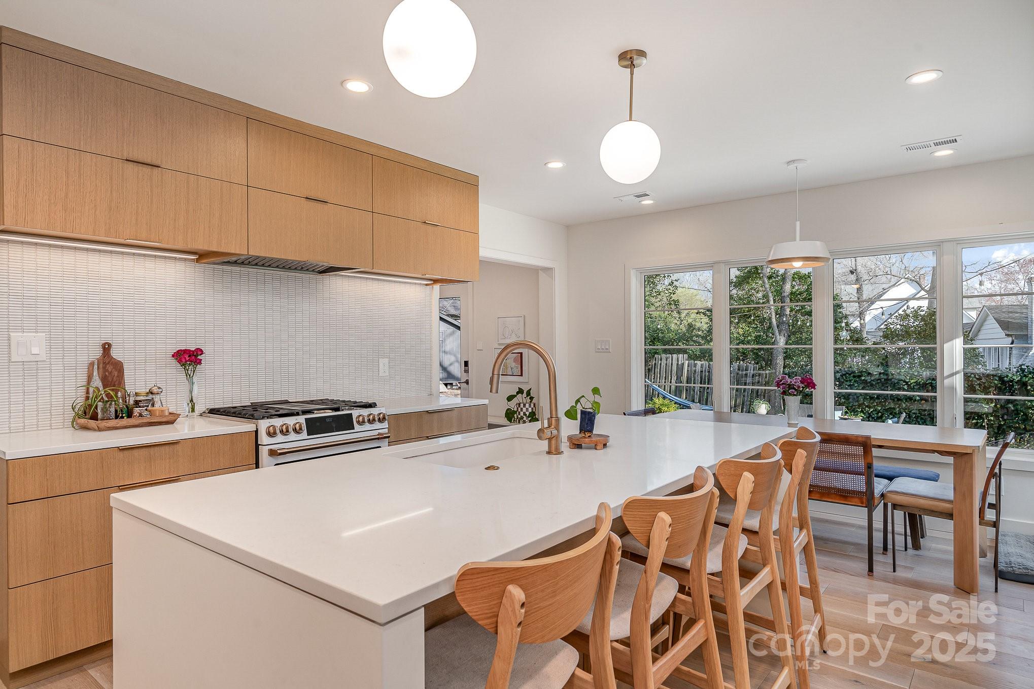 4833 Addison Drive Charlotte, NC 28211 - Photo 17 of 47 a kitchen with sink a stove and a microwave