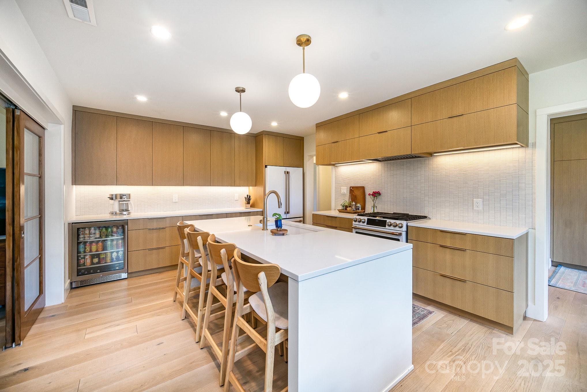 4833 Addison Drive Charlotte, NC 28211 - Photo 19 of 47 a kitchen with a stove a sink and a refrigerator