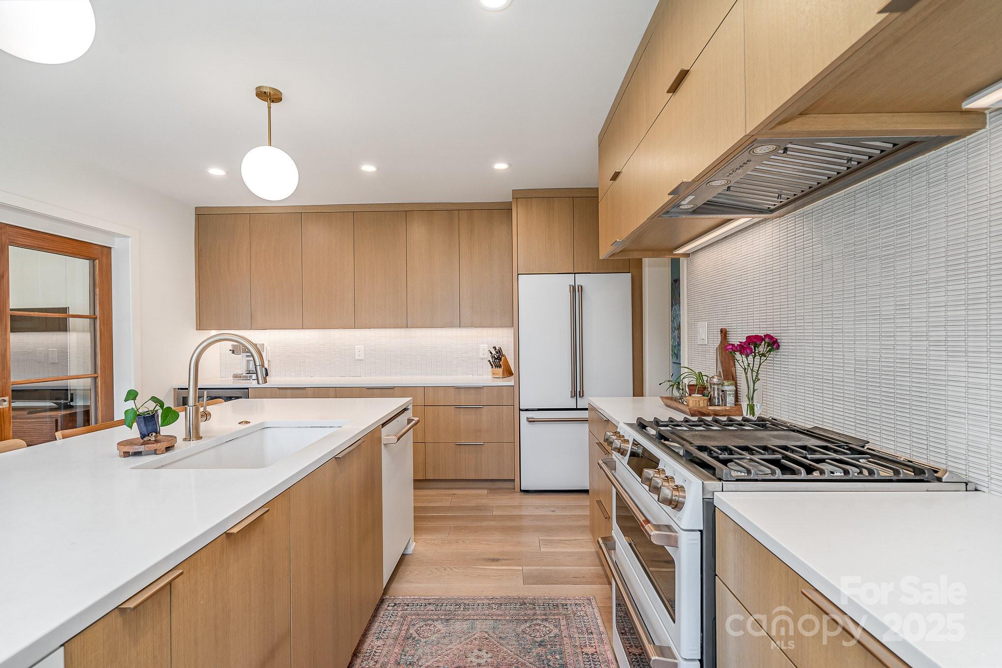 4833 Addison Drive Charlotte, NC 28211 - Photo 20 of 47 a kitchen with a sink stove and refrigerator