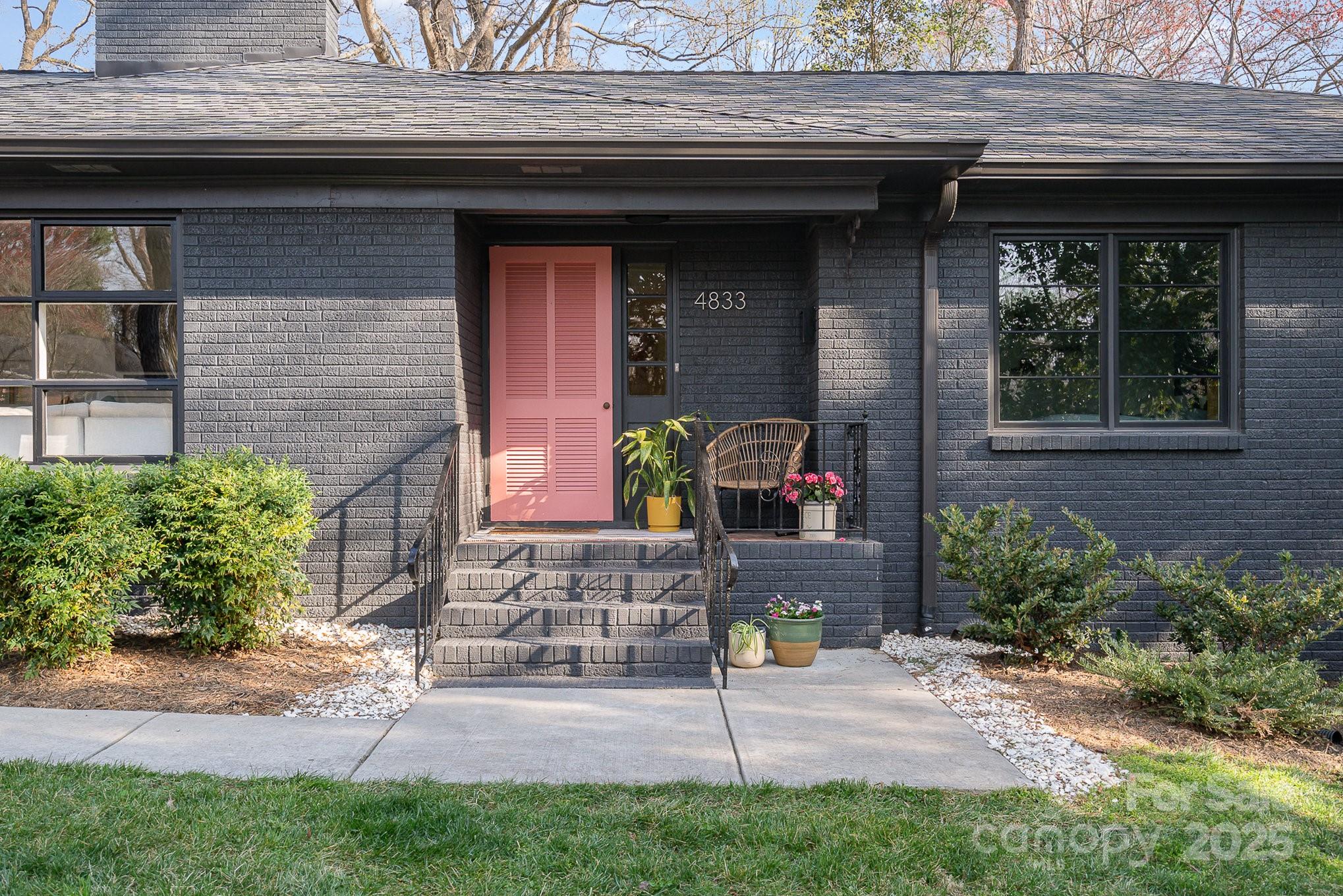 4833 Addison Drive Charlotte, NC 28211 - Photo 2 of 47 a front view of a house with garden