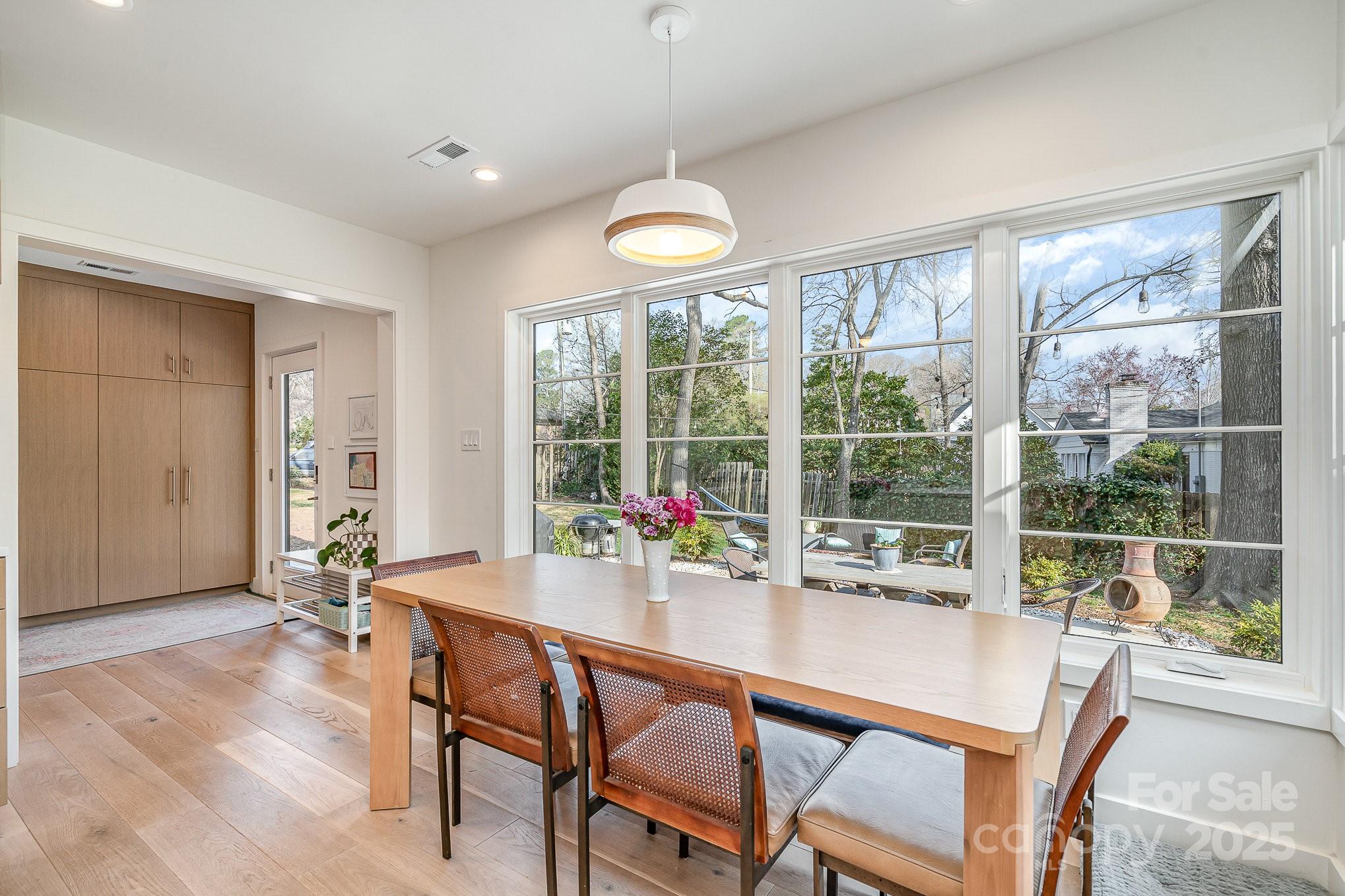 4833 Addison Drive Charlotte, NC 28211 - Photo 22 of 47 a dining room with a large window and table