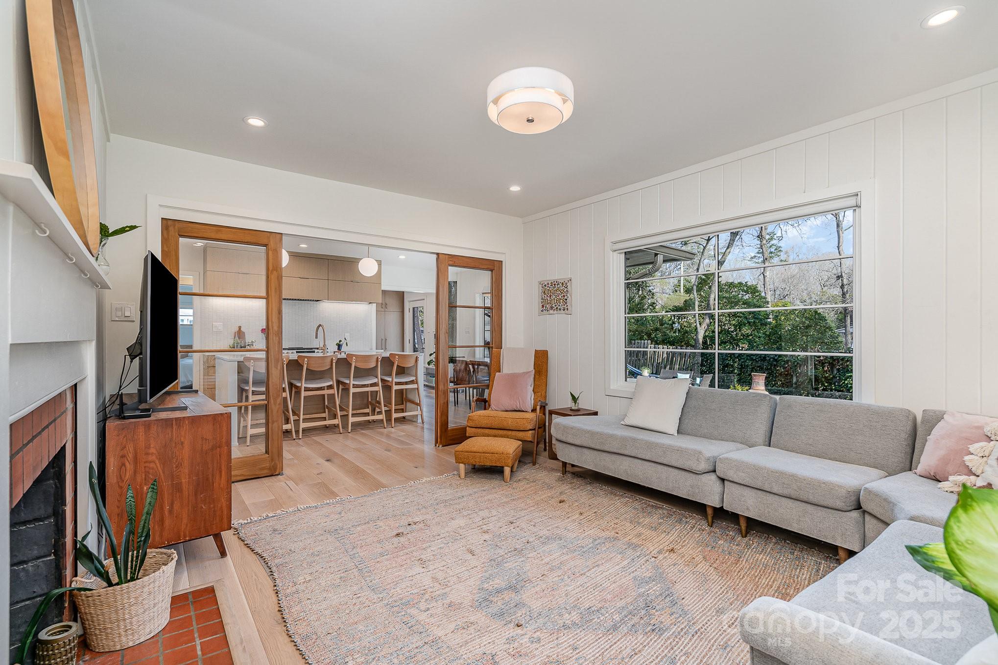 4833 Addison Drive Charlotte, NC 28211 - Photo 27 of 47 a living room with furniture and a flat screen tv