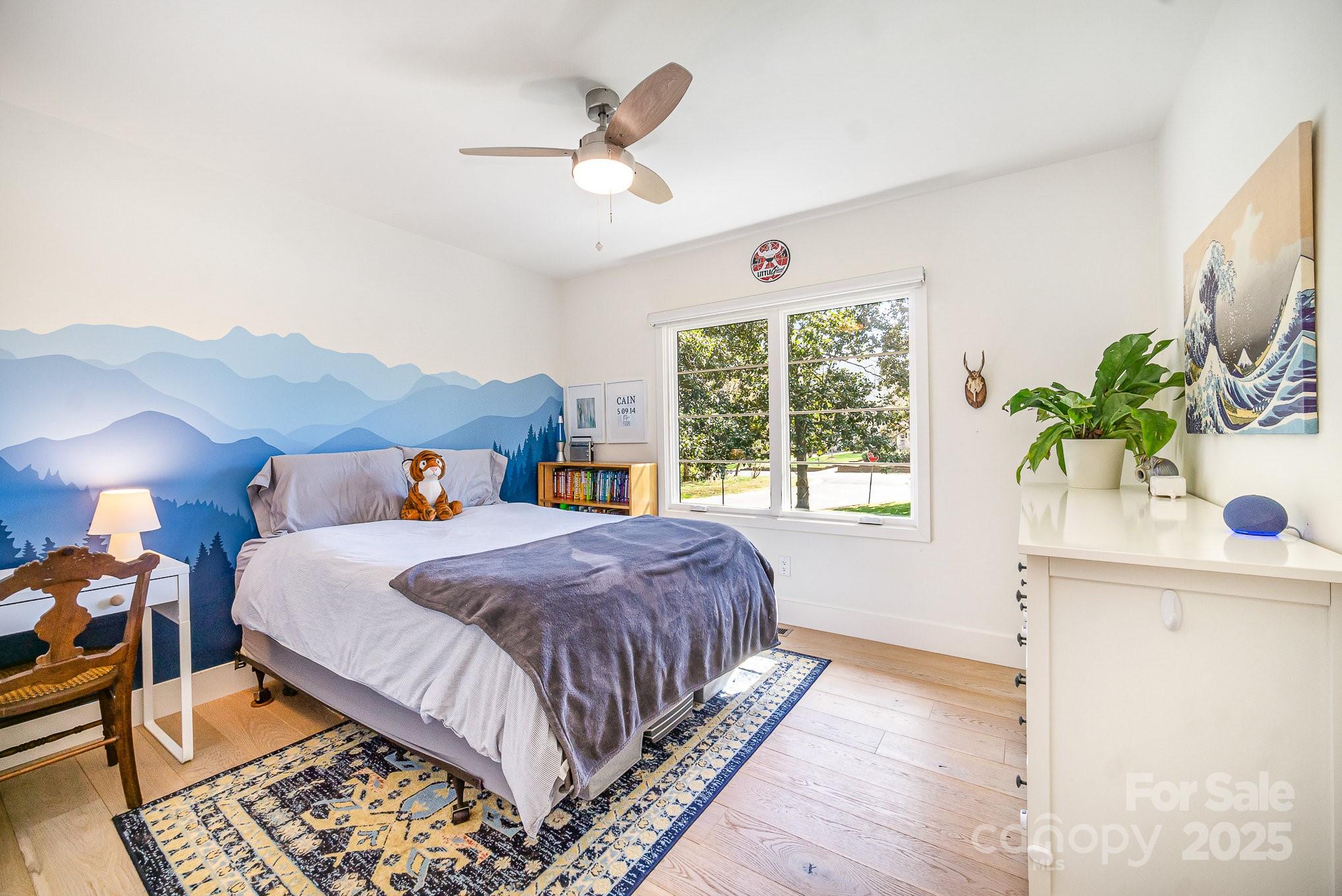 4833 Addison Drive Charlotte, NC 28211 - Photo 29 of 47 a bed sitting in a bedroom next to a window