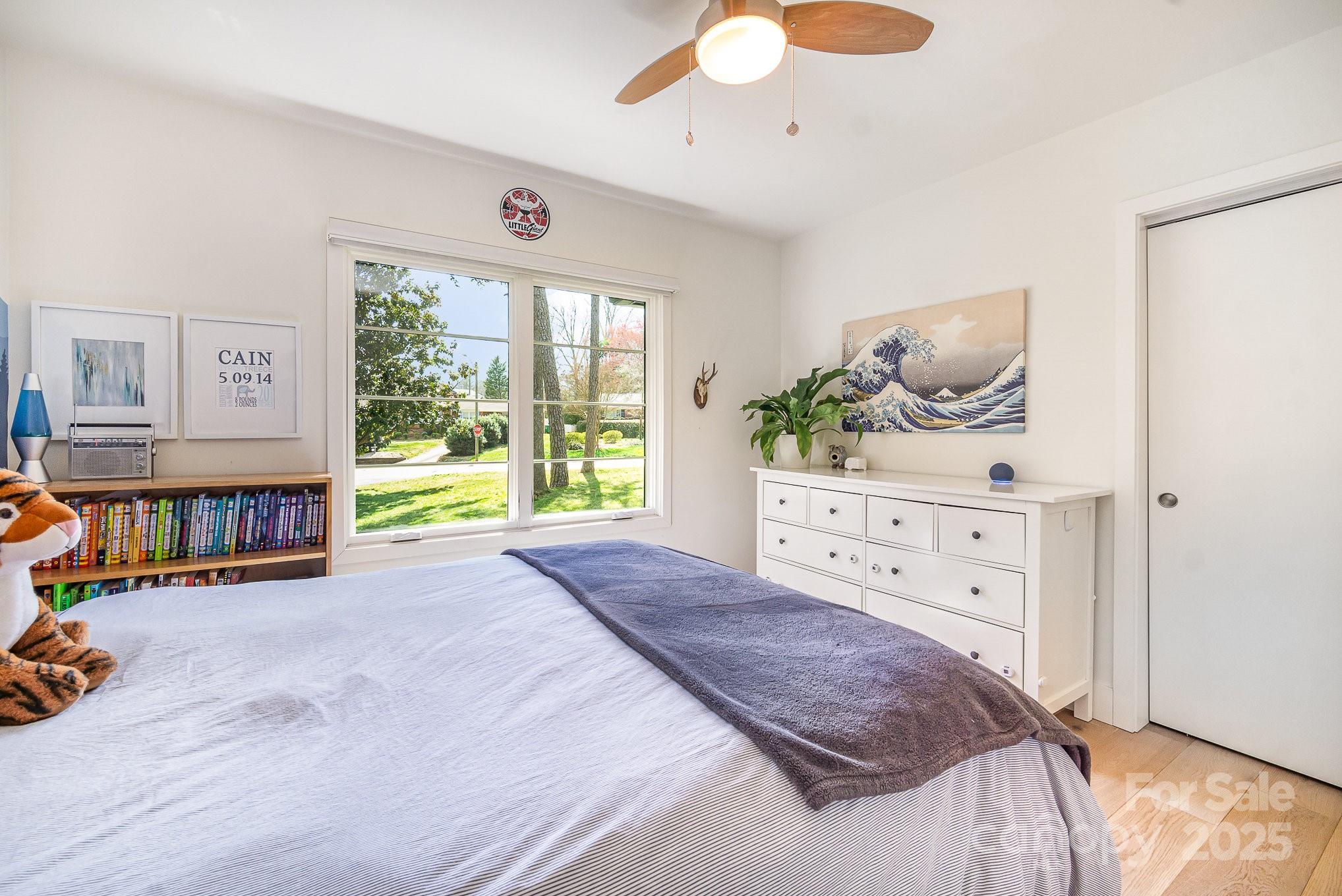 4833 Addison Drive Charlotte, NC 28211 - Photo 30 of 47 a bed room with a bed and a window