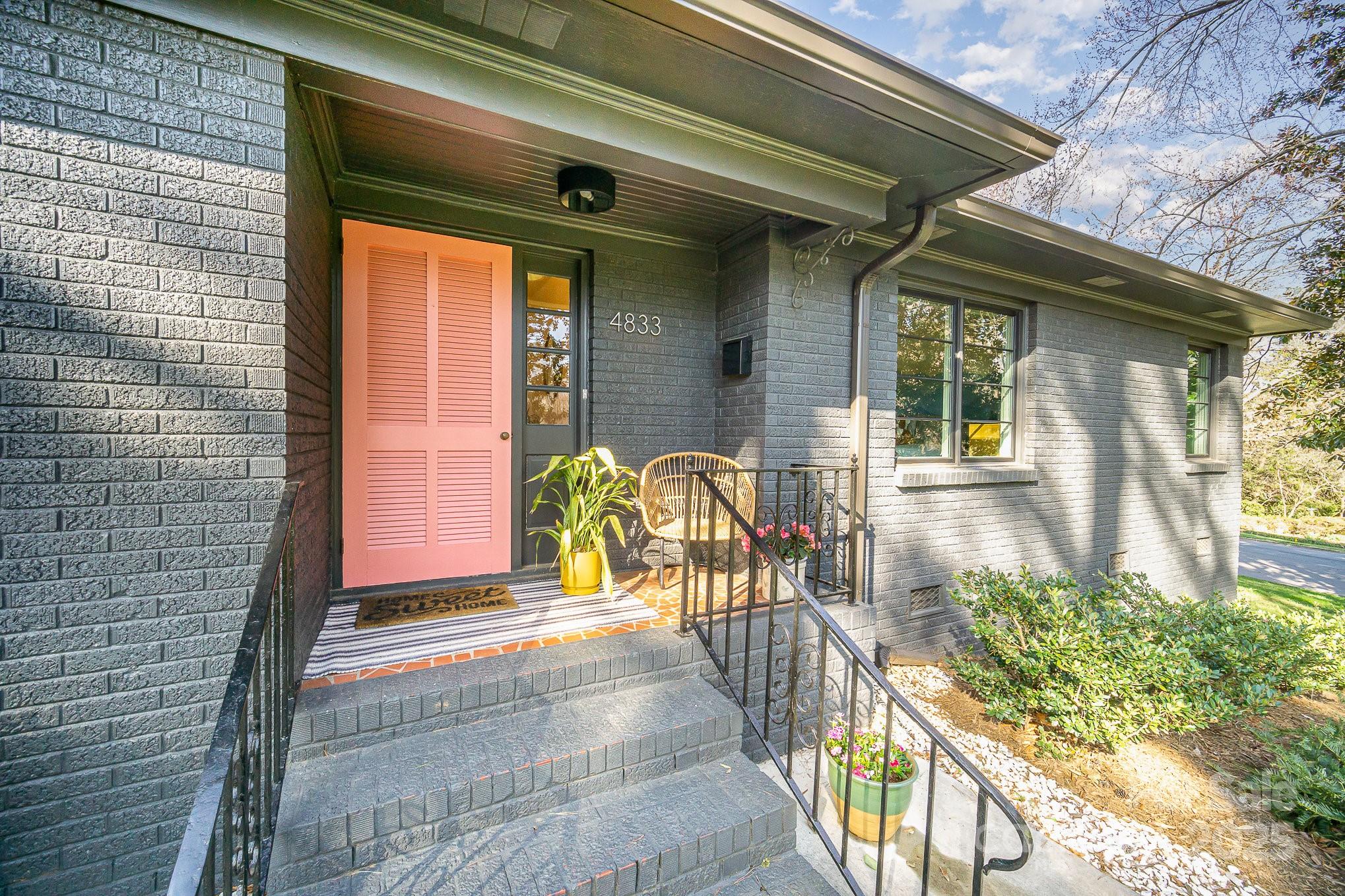 4833 Addison Drive Charlotte, NC 28211 - Photo 3 of 47 a front view of a house with outdoor seating