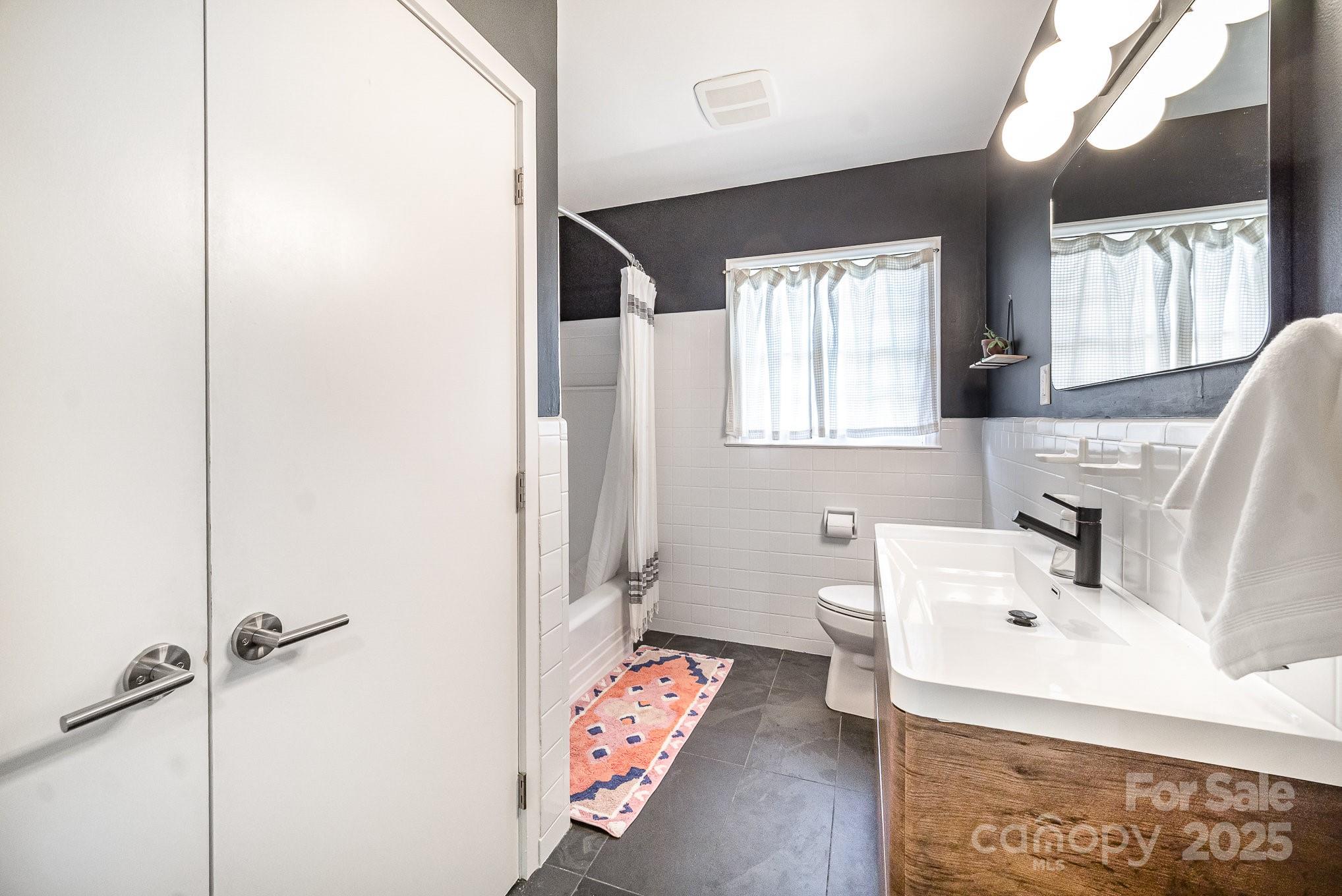 4833 Addison Drive Charlotte, NC 28211 - Photo 31 of 47 a bathroom with a sink toilet and tub