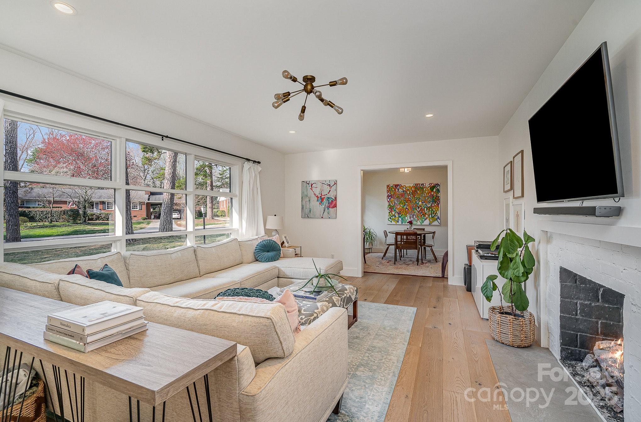 4833 Addison Drive Charlotte, NC 28211 - Photo 5 of 47 a living room with fireplace furniture and a flat screen tv