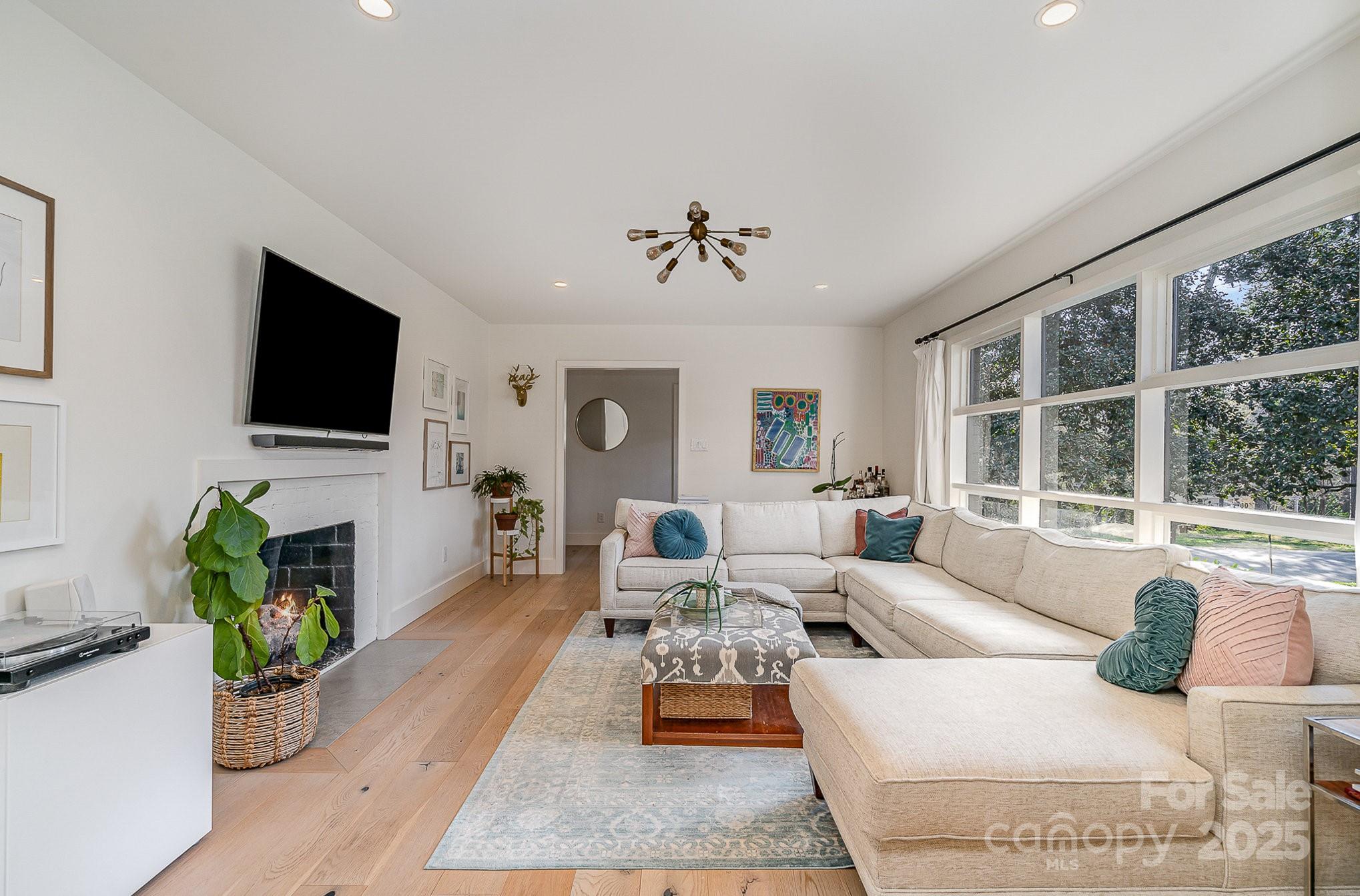 4833 Addison Drive Charlotte, NC 28211 - Photo 7 of 47 a living room with furniture and a flat screen tv