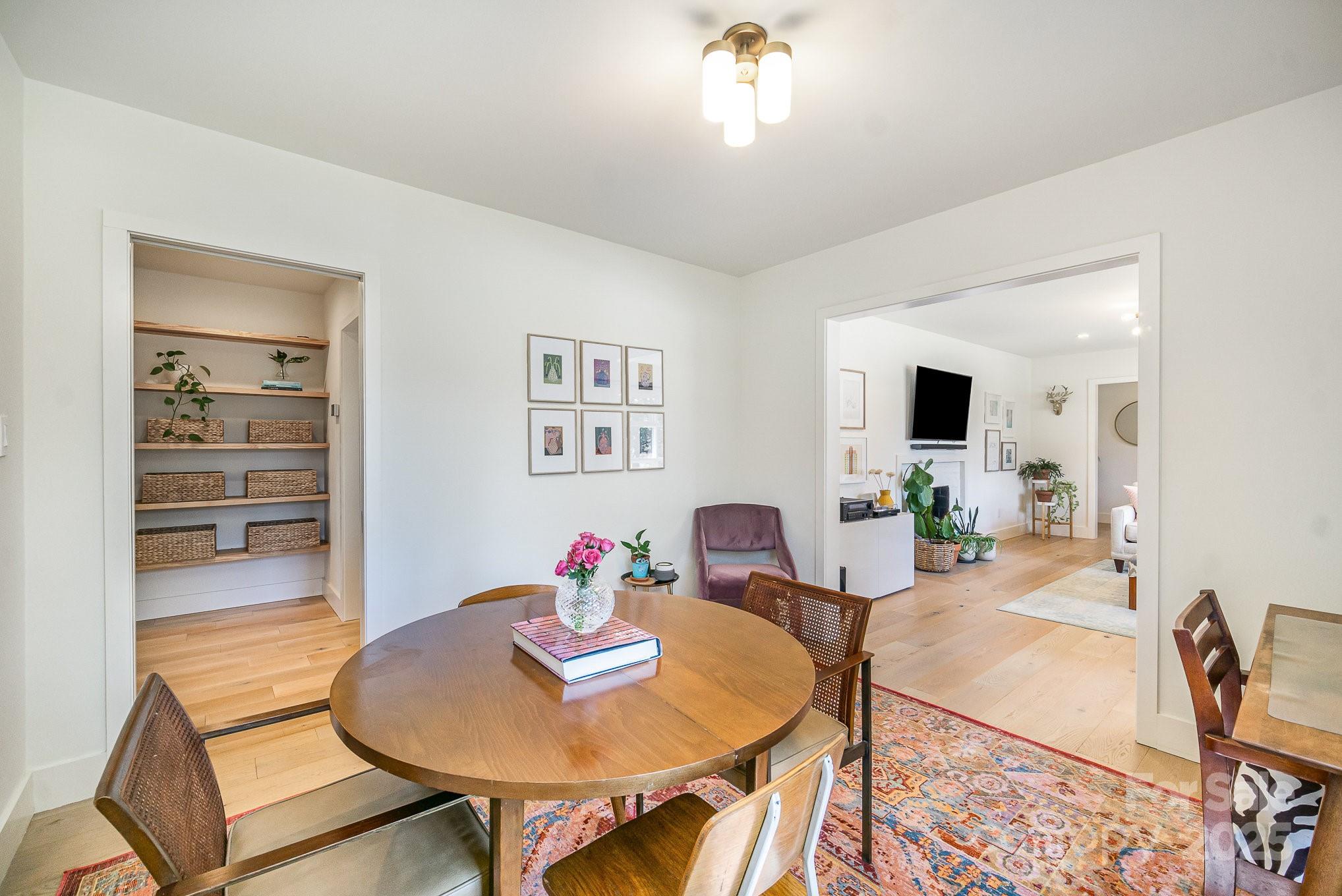 4833 Addison Drive Charlotte, NC 28211 - Photo 8 of 47 a view of a dining room with furniture and wooden floor