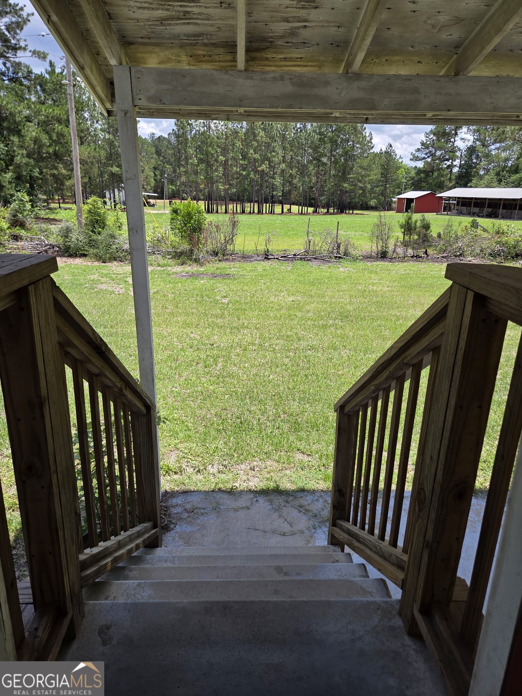 9546 Union Road Metter, GA 30439 - Photo 35 of 45 a view of outdoor space with deck and a yard