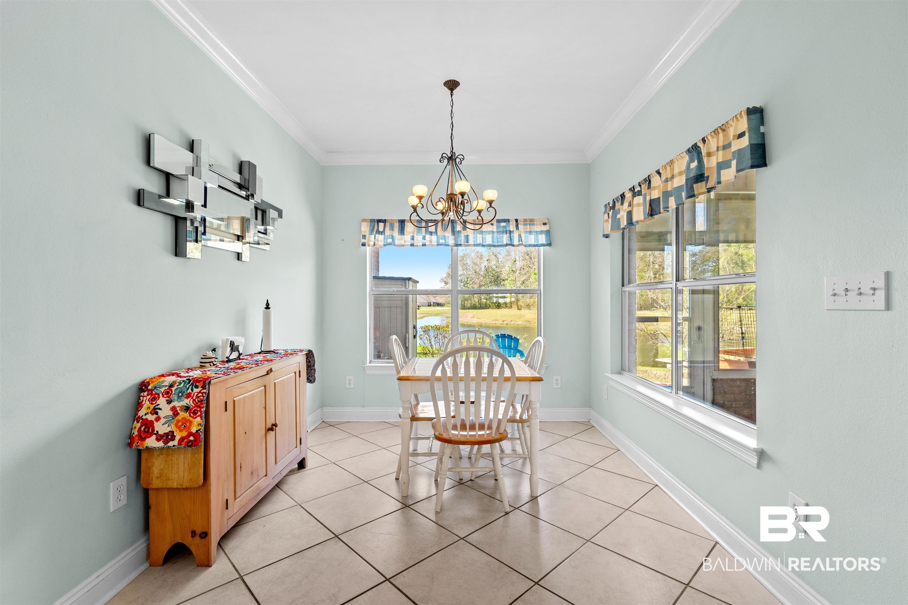 237 Hemingway Loop Foley, AL 36535 - Photo 13 of 49 Dining room featuring a chandelier, baseboards, and ornamental molding