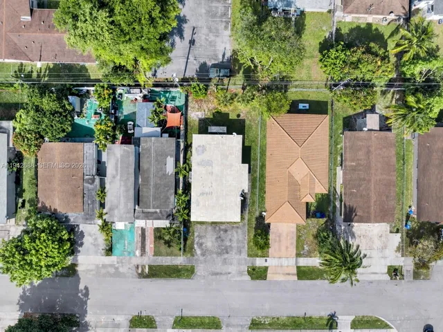 an aerial view of multiple houses with outdoor space