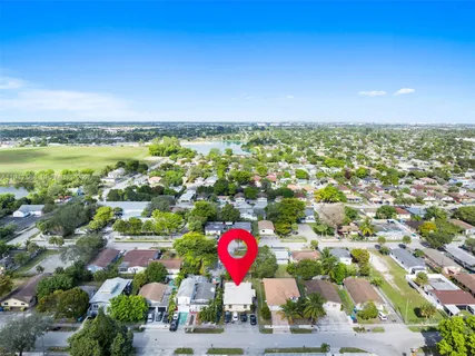 an aerial view of residential houses with outdoor space