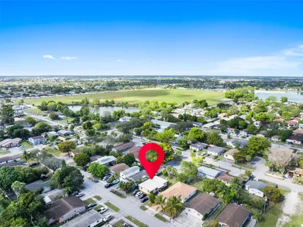 an aerial view of residential houses with outdoor space
