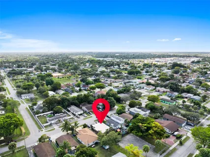 an aerial view of a parking space and city view