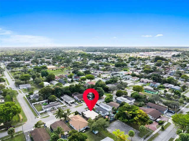 an aerial view of a parking space and city view