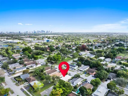 an aerial view of residential houses with outdoor space