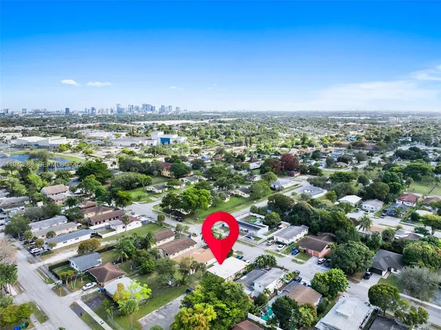 an aerial view of residential houses with outdoor space