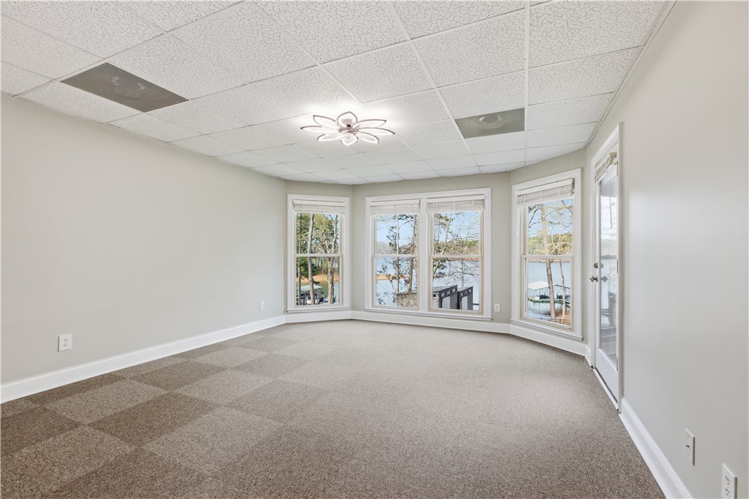 501 Capri Point Lavonia, GA 30553 - Photo 2 of 50 This versatile room offers expansive views, creating an inviting space for various uses.