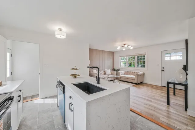 a view of a room with a ceiling fan