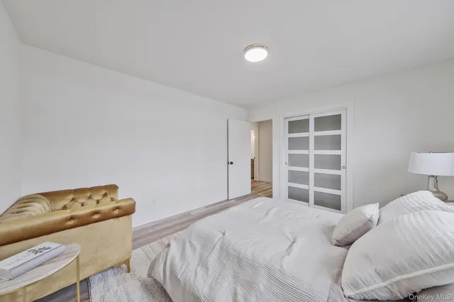 a bedroom with a bed and a couch