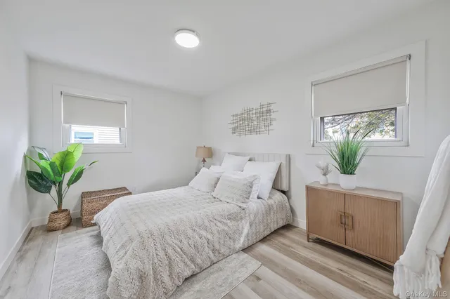 a bedroom with a bed and a bathroom