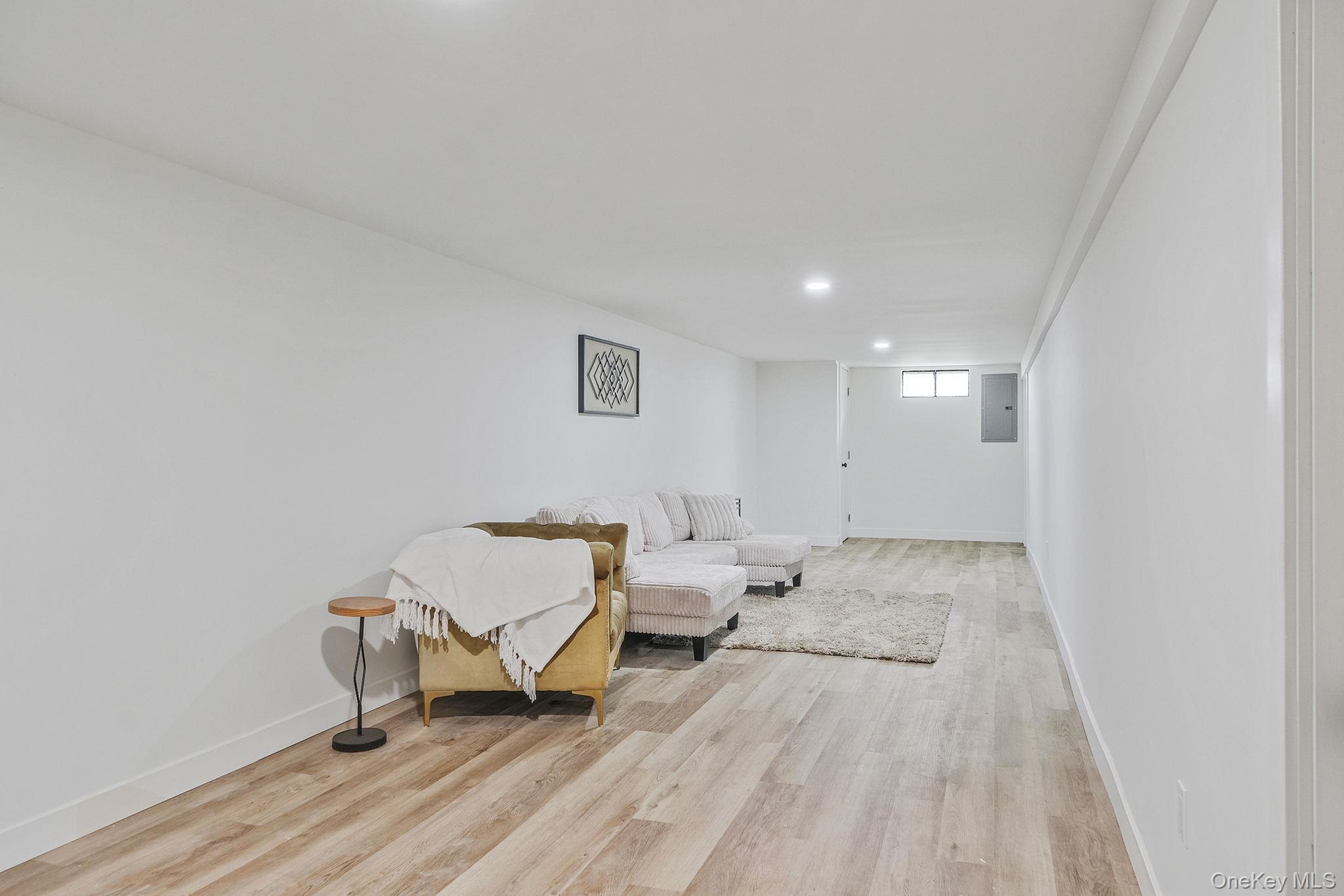120 Manhattan Avenue West Babylon, NY 11704 - Photo 25 of 32 a spacious bedroom with a bed and a table