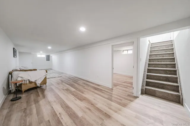 a spacious bedroom with a bed and a table