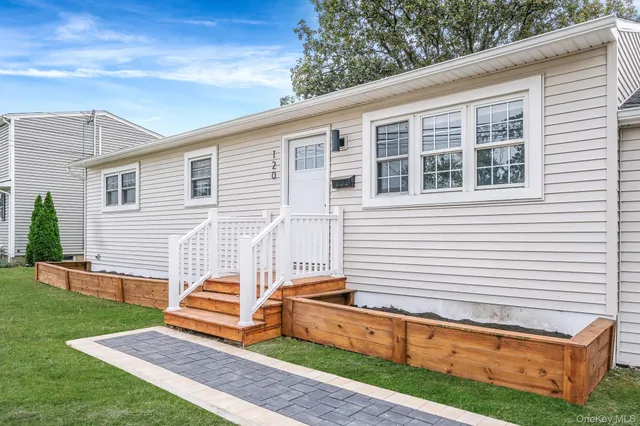 a backyard of a house with wooden floor and fence