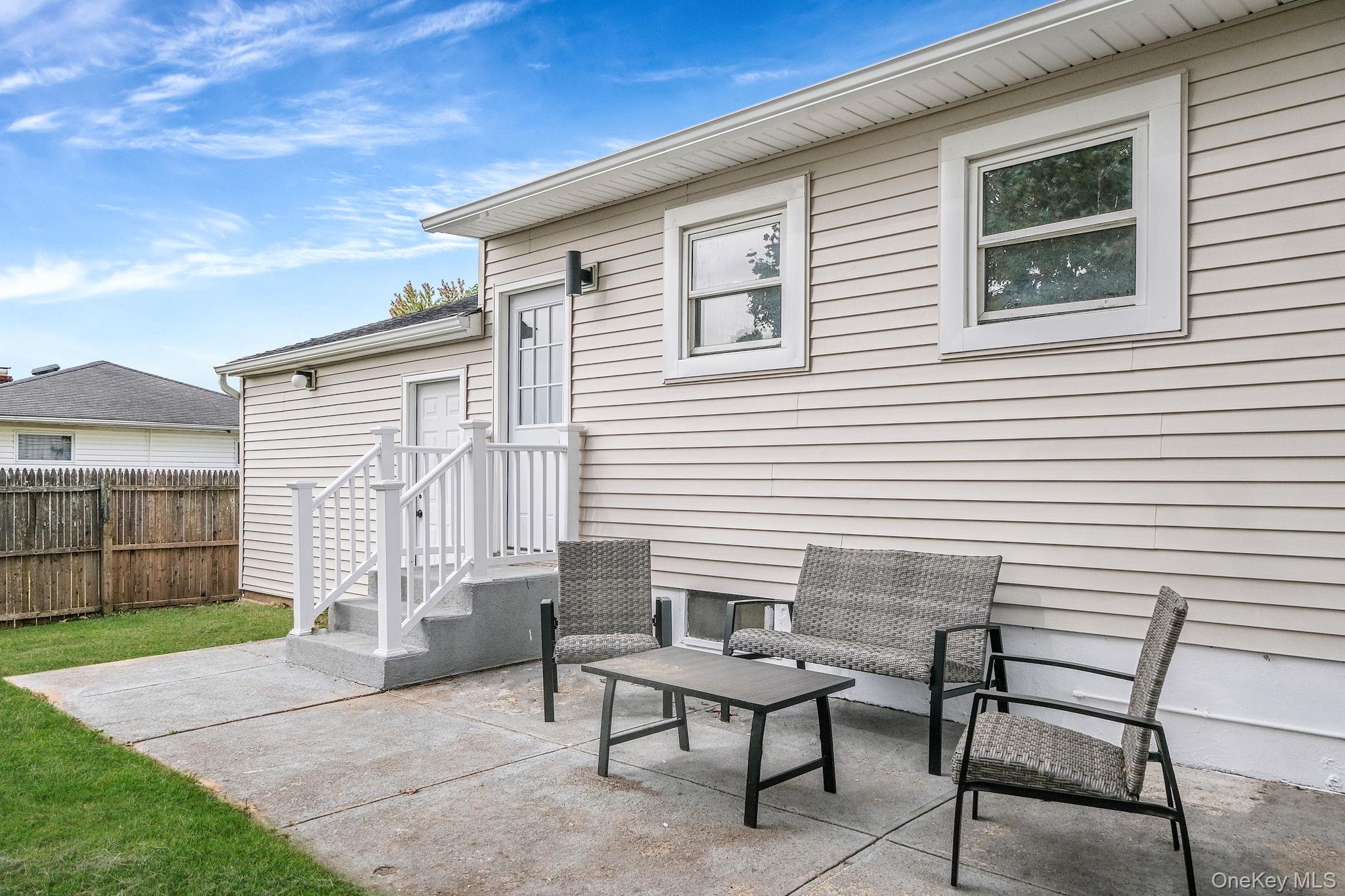 120 Manhattan Avenue West Babylon, NY 11704 - Photo 8 of 32 a view of a house with backyard and sitting area