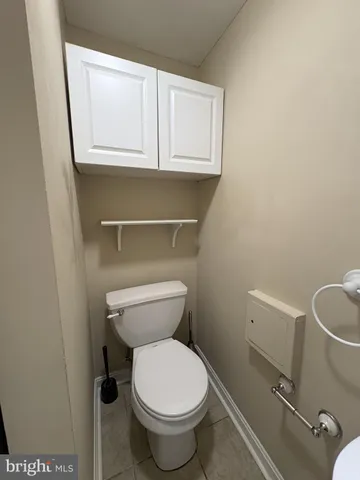 a bathroom with a toilet and a sink