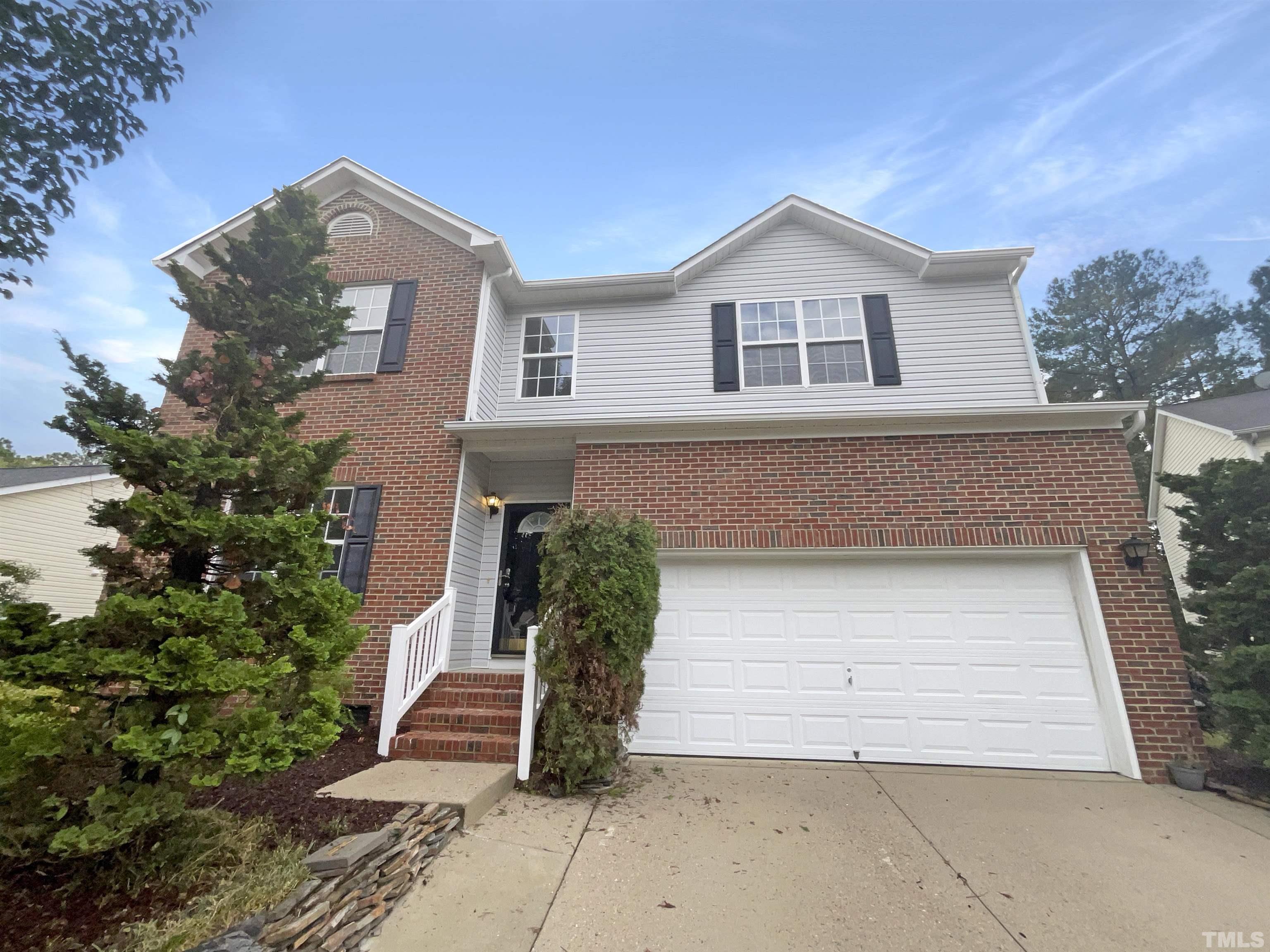 5408 Neuse Planters Court Raleigh, NC 27616 - Photo 1 of 17 a front view of a house with a garage