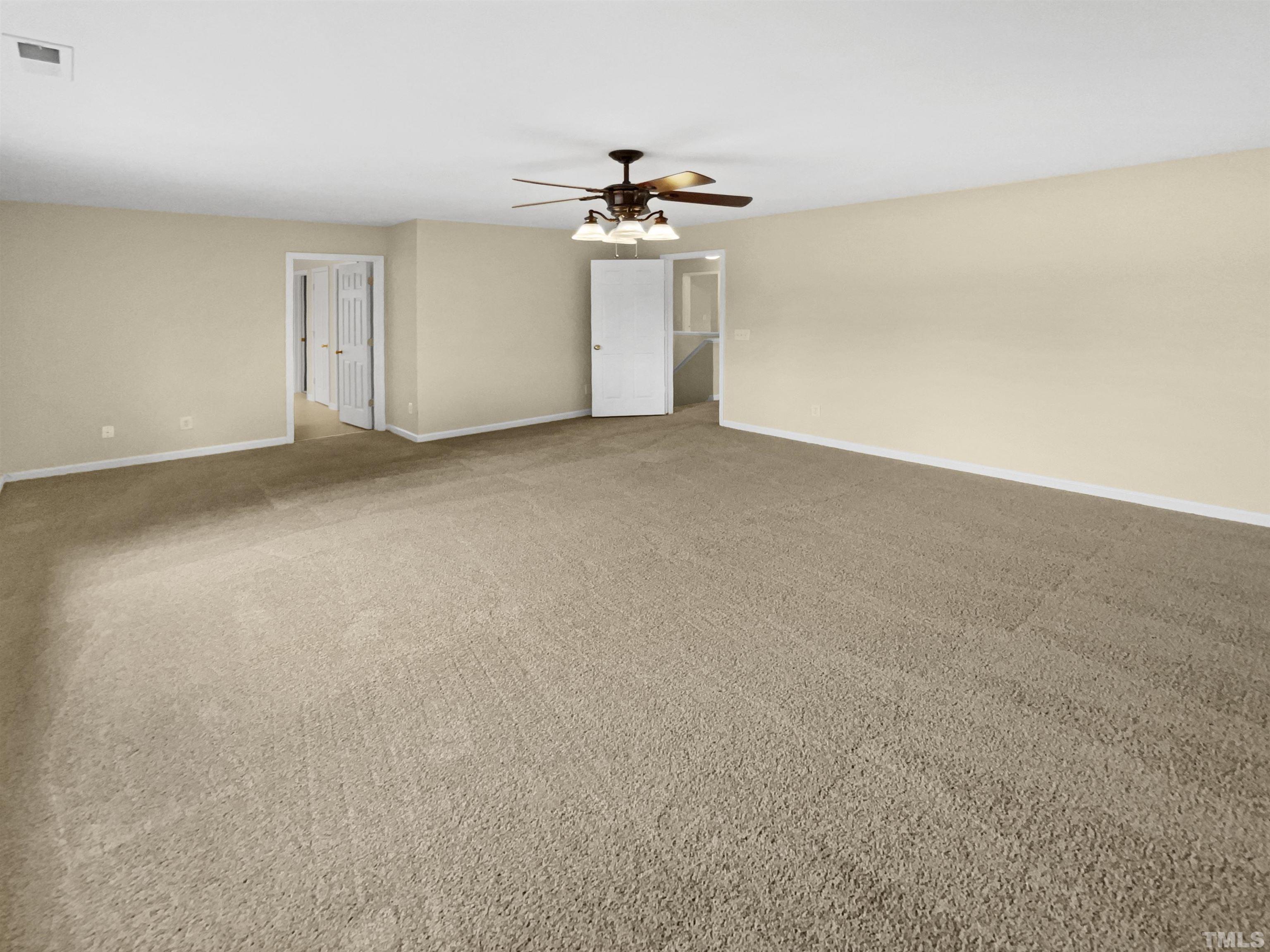 5408 Neuse Planters Court Raleigh, NC 27616 - Photo 14 of 17 a view of a livingroom with a ceiling fan