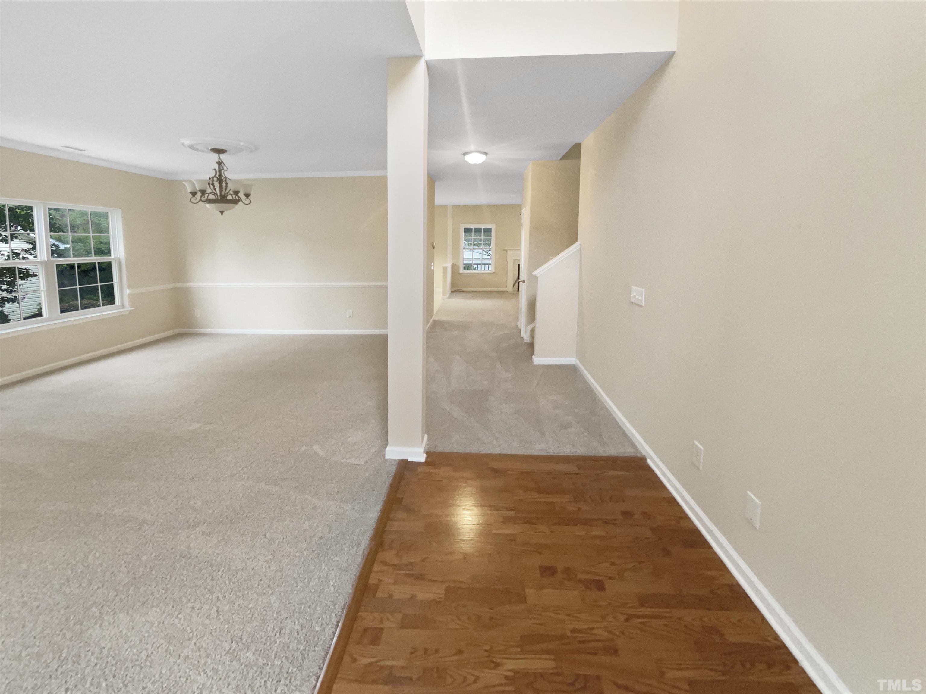 5408 Neuse Planters Court Raleigh, NC 27616 - Photo 5 of 17 an entryway in a hall with a window