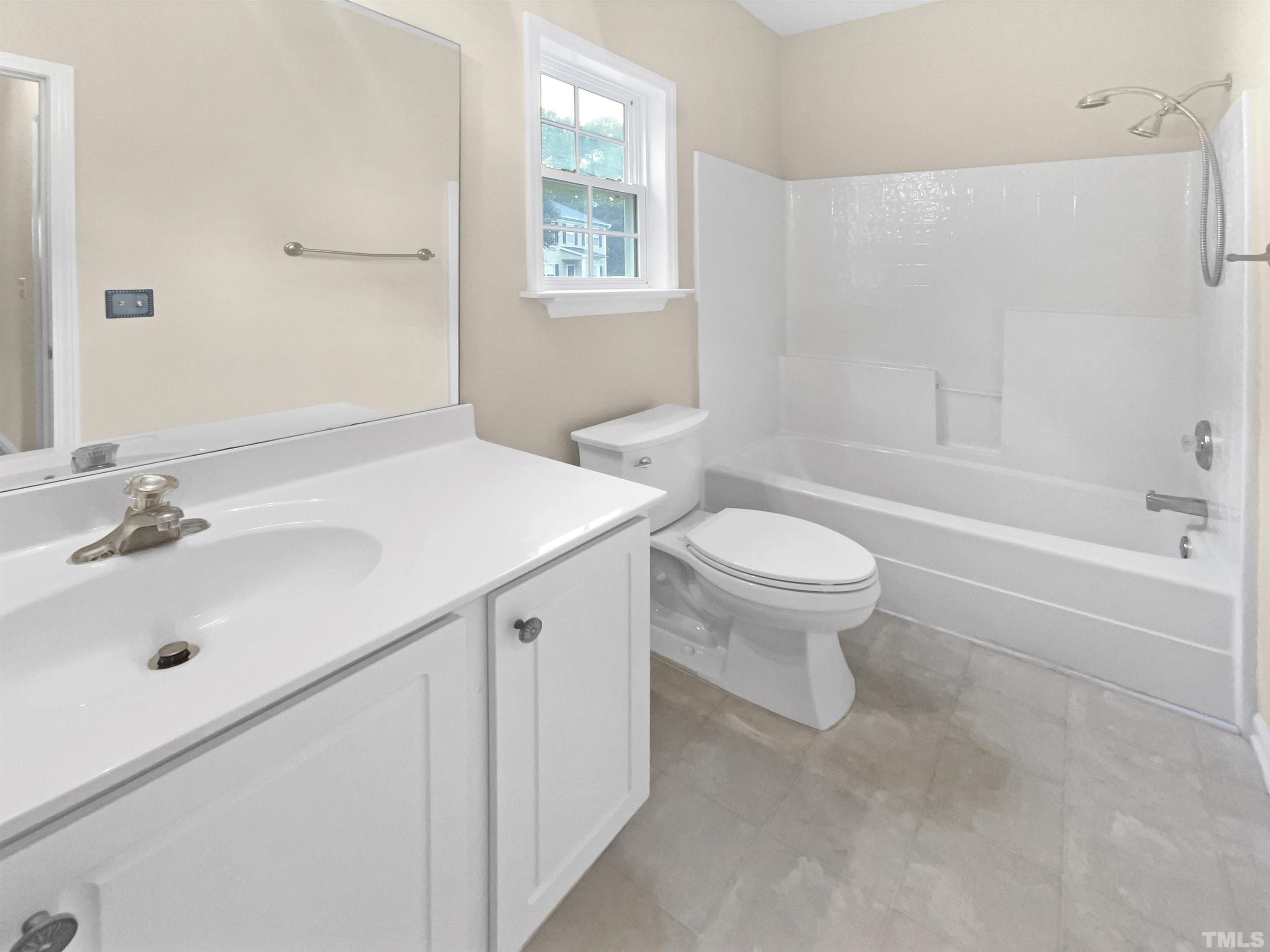 5408 Neuse Planters Court Raleigh, NC 27616 - Photo 8 of 17 a bathroom with a sink toilet and shower