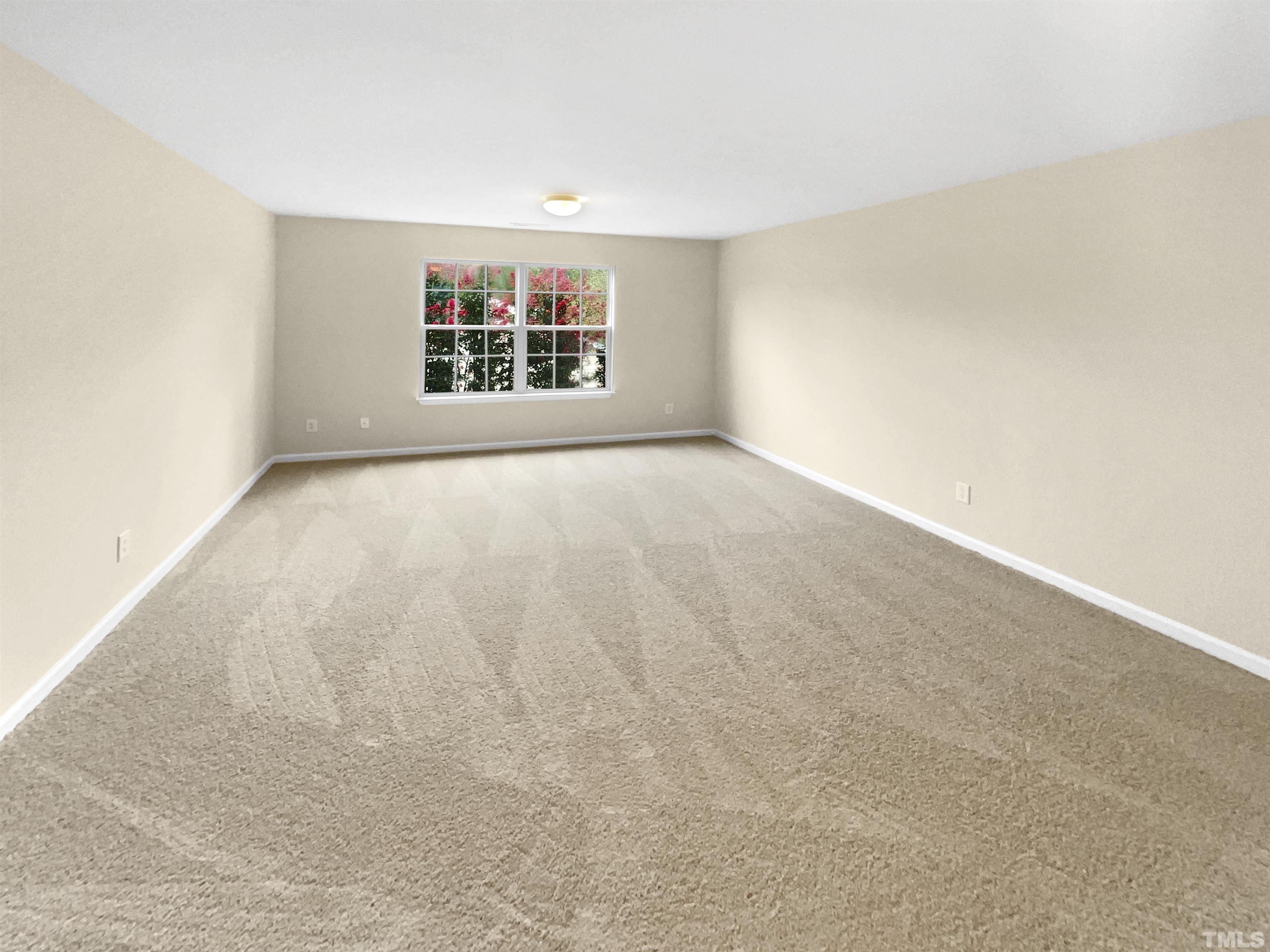 5408 Neuse Planters Court Raleigh, NC 27616 - Photo 9 of 17 an empty room with windows