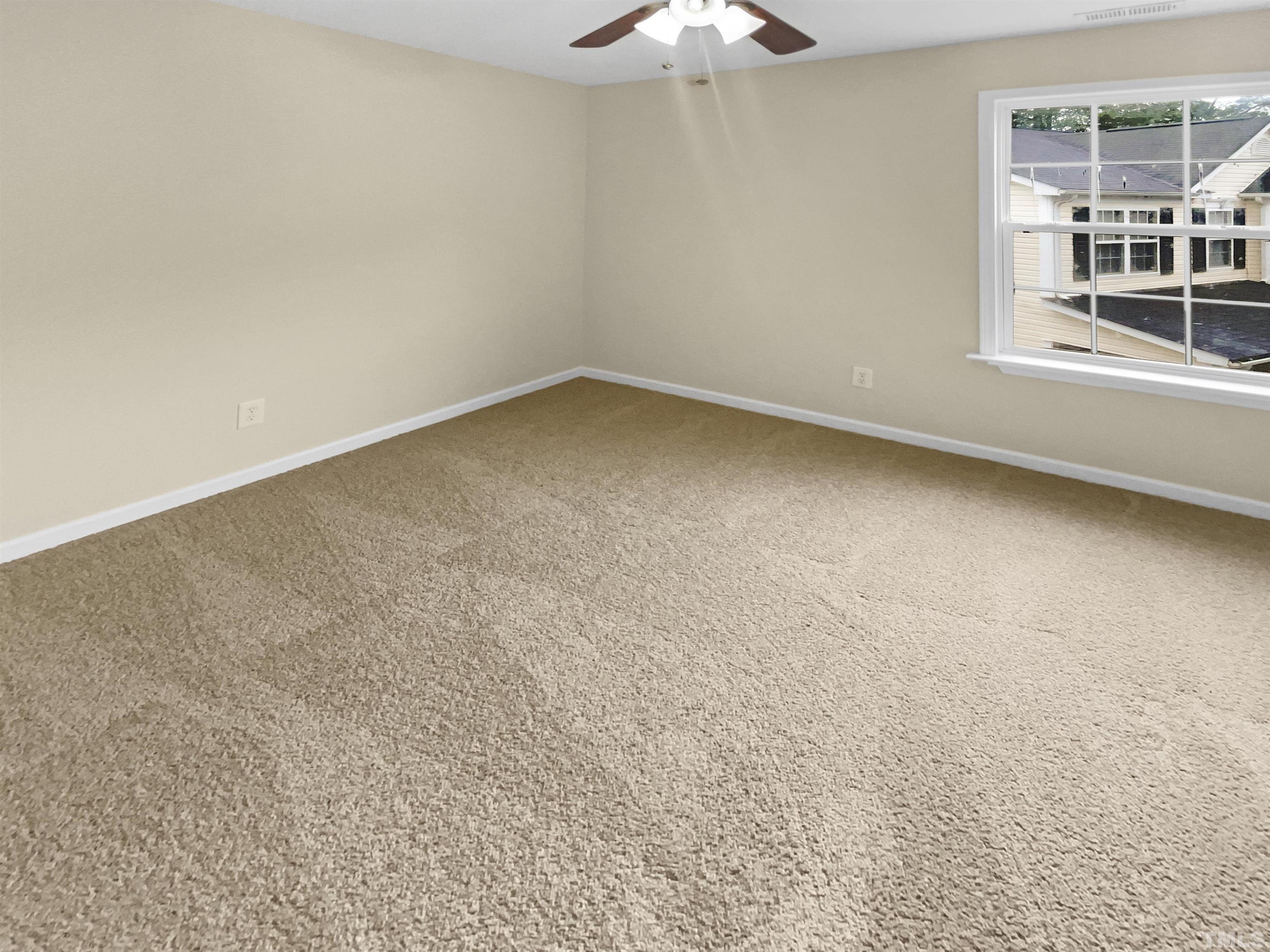 5408 Neuse Planters Court Raleigh, NC 27616 - Photo 10 of 17 an empty room with a window