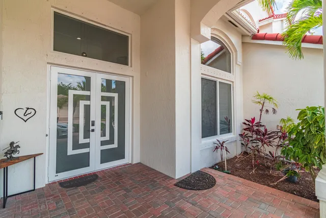 a view of a entryway with storage and utility room