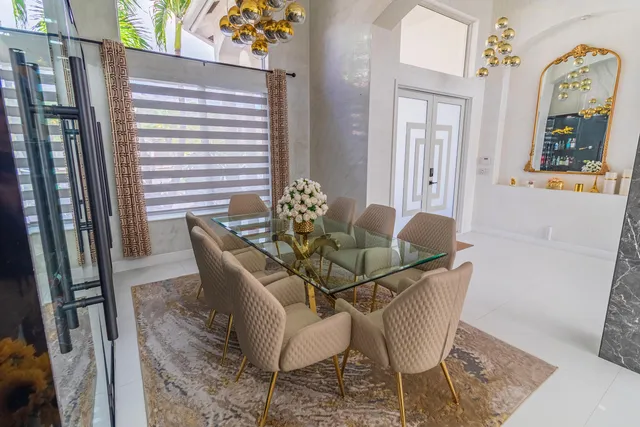 a bathroom with a sink a toilet a mirror and shower