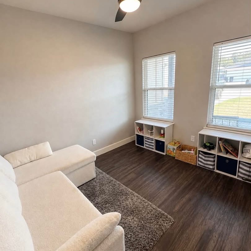 1114 Elkins Road Tuscola, TX 79562 - Photo 3 of 8 Gleaming hardwood floors and abundant natural light define this versatile living space.