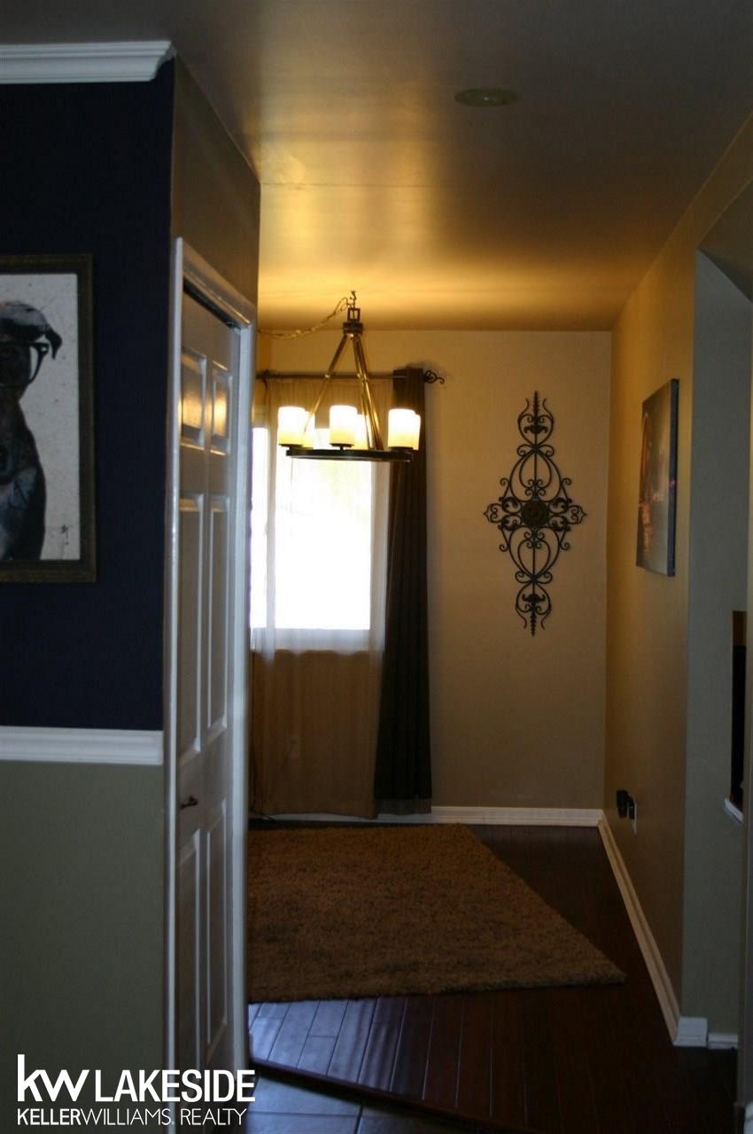 8787 Clinton River Road Sterling Heights, MI 48314 - Photo 10 of 20 Notice the newer laminate wood floors upon entering your home.