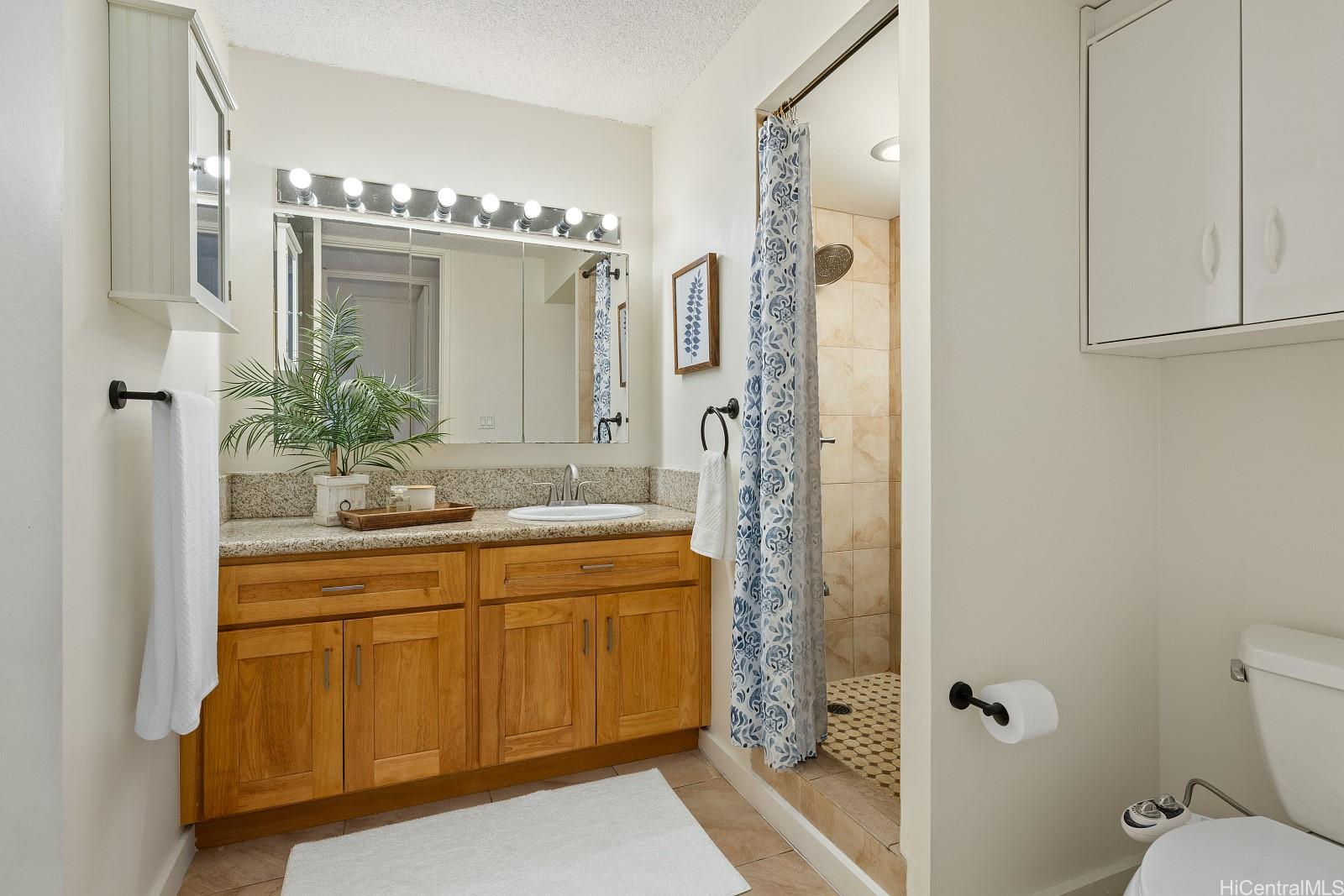 620 McCully Street, Unit 703 Honolulu, HI 96826 - Photo 15 of 25 The bathroom has been upgraded