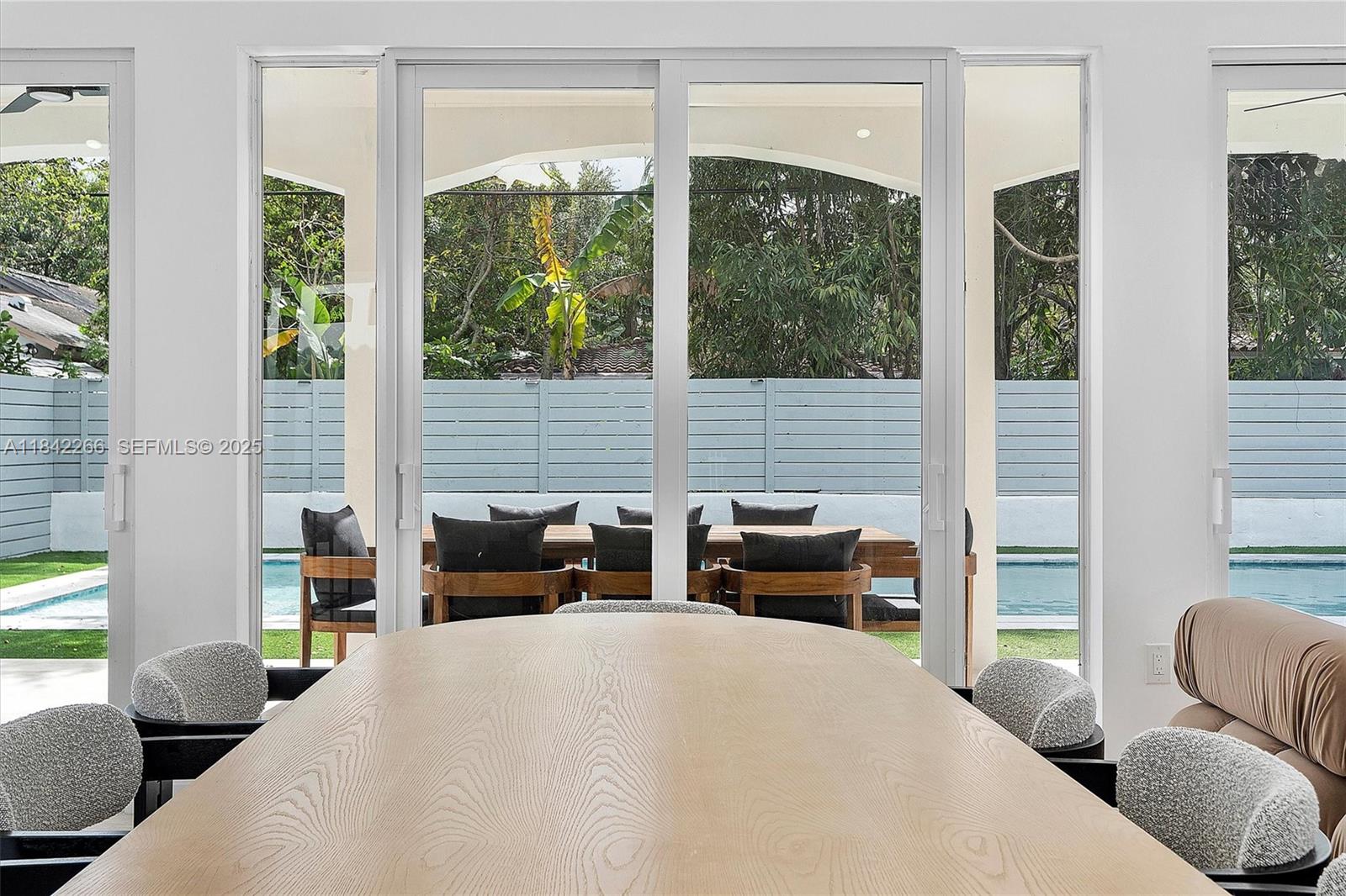 58 Northeast 45th Street Miami, FL 33137 - Photo 13 of 55 a bedroom with furniture and large windows