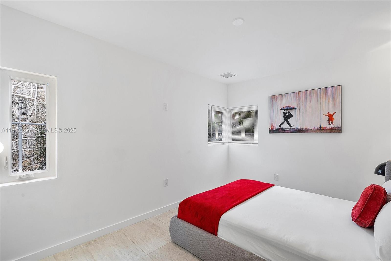 58 Northeast 45th Street Miami, FL 33137 - Photo 23 of 55 a bedroom with a bed and a window