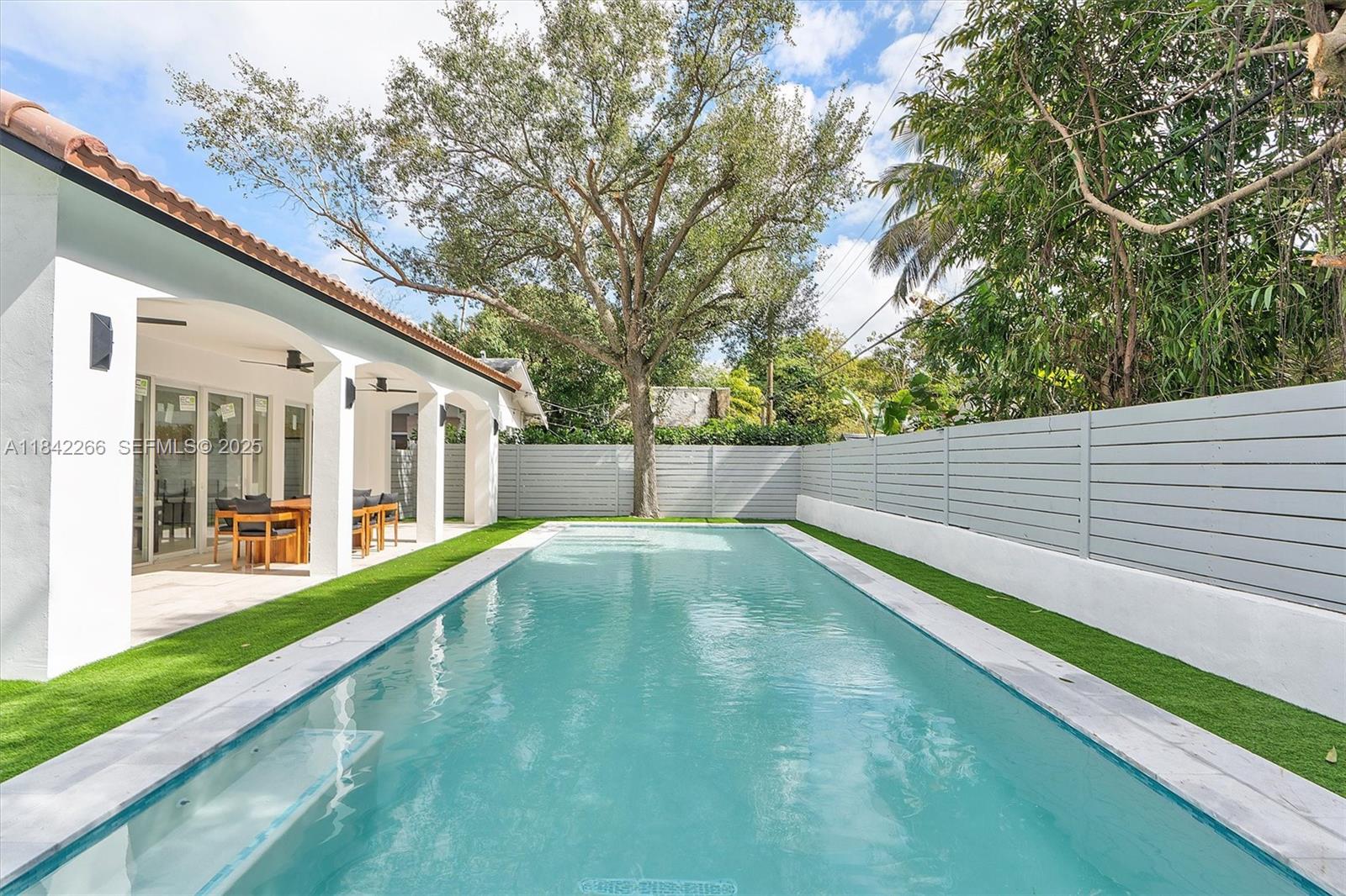 58 Northeast 45th Street Miami, FL 33137 - Photo 29 of 55 a view of an outdoor space with a swimming pool